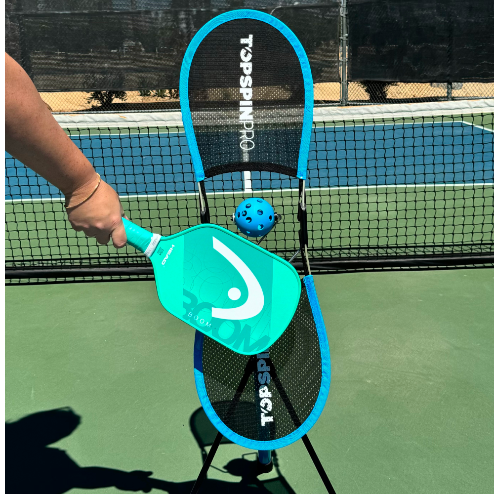 Player hitting a forehand on the TopspinPro, viewed from behind